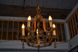 One of the old chandeliers lighting the cabin